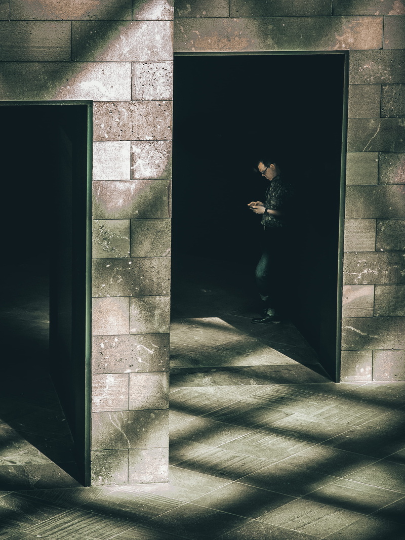 one person, window, shadow, phone, unrecognizable person, indoors, dark, building, 2K, real people, men, nature, transparent, door, standing, hallway