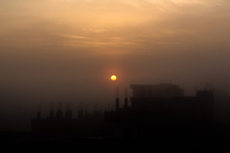 office building exterior, skyscraper, sun, sunrise, building, building exterior, outdoors, orange color, natural, morning, urban skyline, smog, nature
