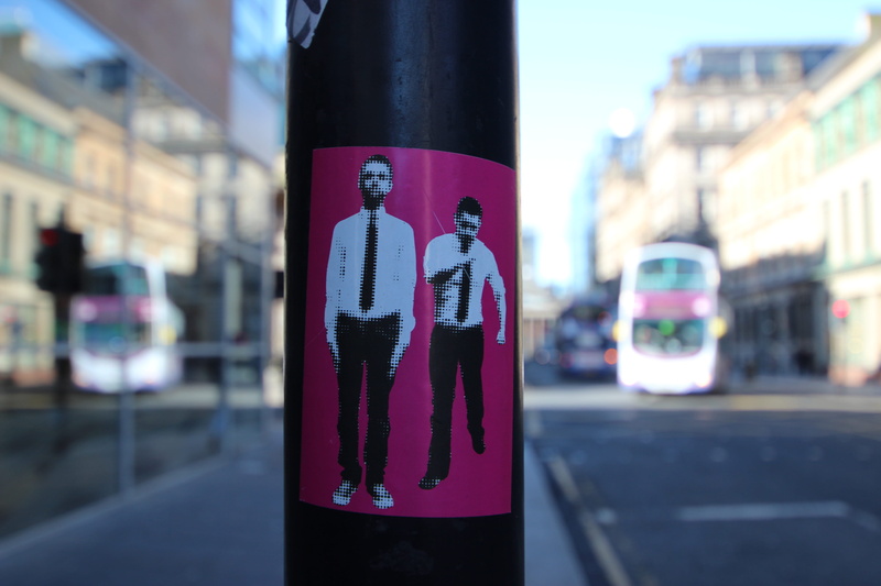 post, human representation, glasgow, bulding, close-up, communication, tie, bus, built structure, mode of transportation, outdoors, representation, sign