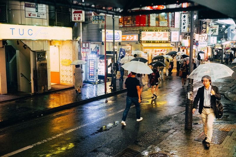 rainy season, street, building exterior, group of people, lifestyles, umbrella, real people, wet, people, transportation, women, full length, crowd, night