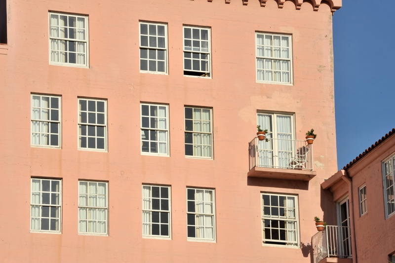 wall - building feature, day, shadow, in a row, residential building, outdoors, low angle view, nature, residential district, window, building exterior