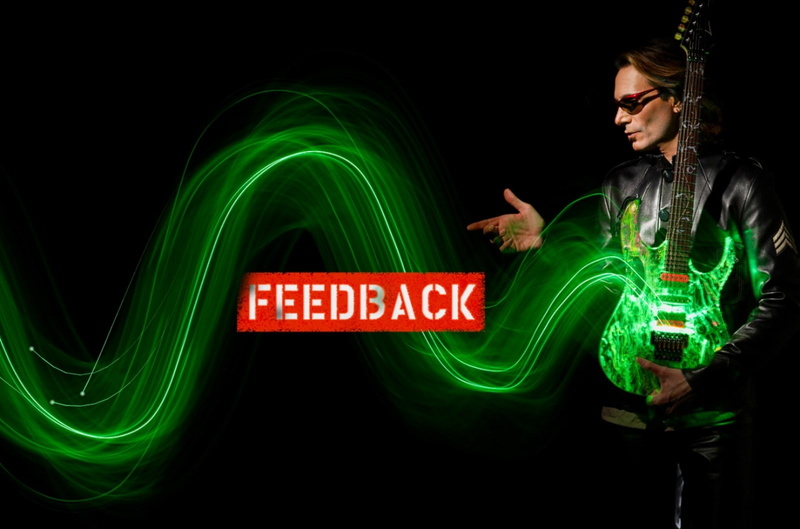 sign, western script, 720P, one person, studio shot, emotion, excitement, motion, adult, black background, neon, steve vai, young adult, illuminated, long exposure