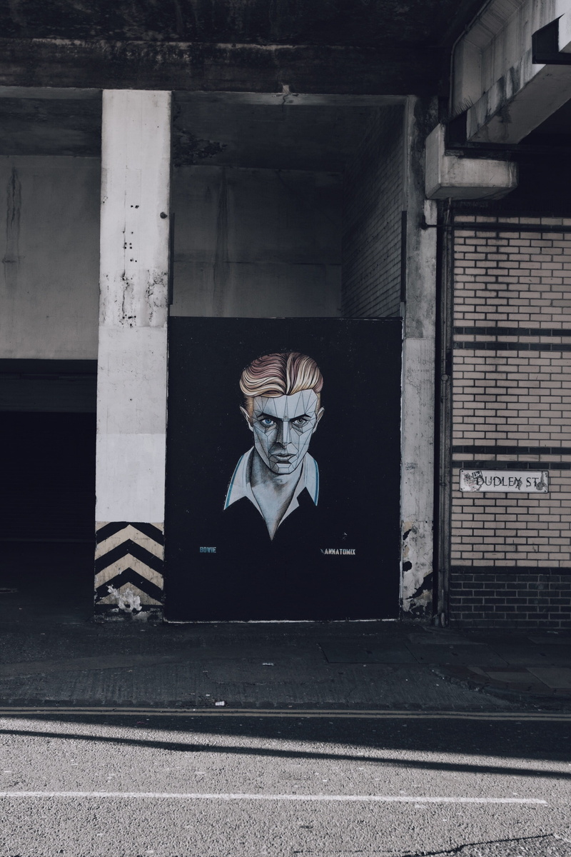built structure, streetart, outdoors, david bowie, wall, architectural column, wearing, portrait, day, collared, representation, looking at camera, real people