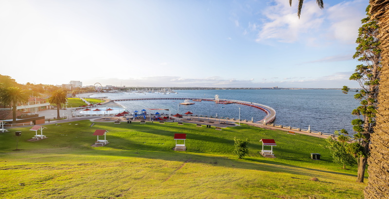grass, airfield, green color, shoreline, sea, vehicle, beach, field, beauty in nature, architecture, boat, waterfront, land, day, tree, cloud - sky, transportation