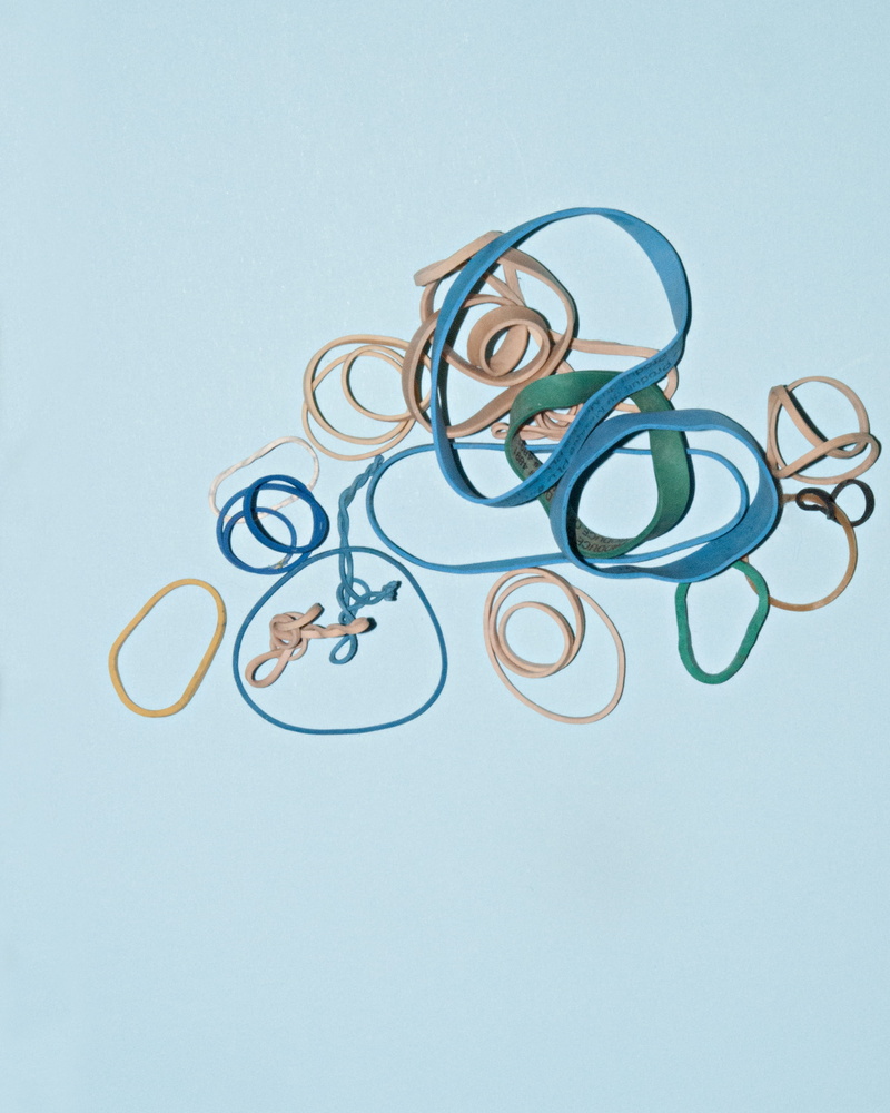 still life, colored background, loom, variation, elastic band, yellow, rubber band, emblem, alphabet, drawing, art and craft, text, arrangement, calligraphy