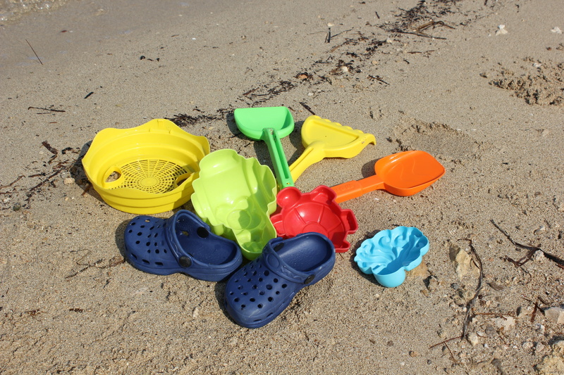 sunlight, sea, holidays, toys, blue, still life, yellow, beach, container, group of objects, nature, sand pail and shovel, green color, high angle view
