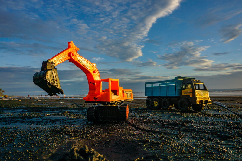 summer, land vehicle, land, sea, toy, industry, bucket, sandcastle, industrial equipment, beach, dig, outdoors, child, sky, yellow, orange color, vacation