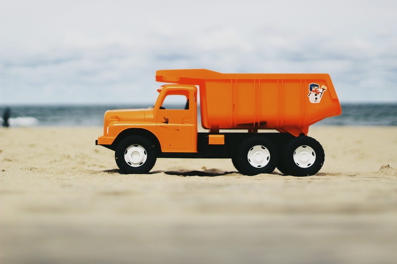 land, orange, water, car, business, no people, orange color, 5K, wheel, pick-up truck, plastic toy, land vehicle, motor vehicle, day, outdoors, sand, photo