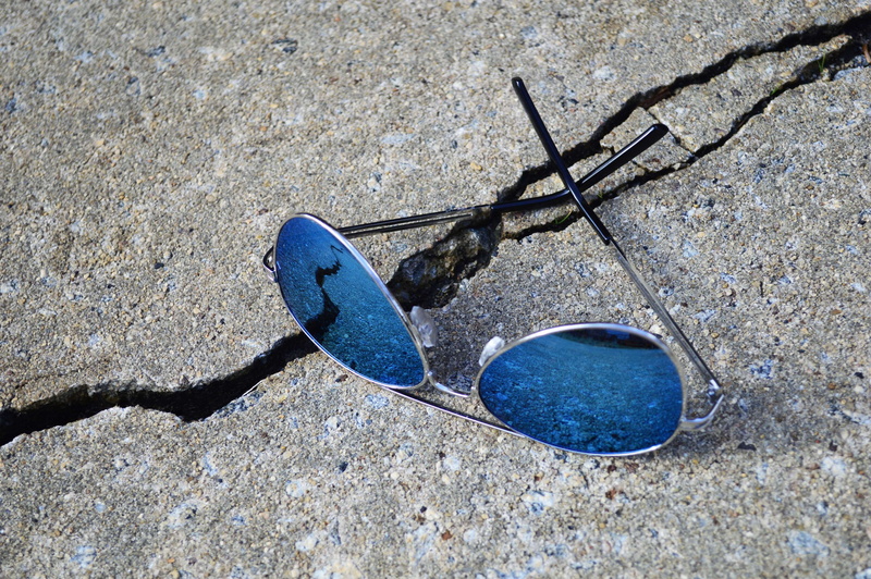cracked, land, personal accessory, shadow, abandoned, aviator sunglasses, concrete, blue, high angle view, directly above, metal, close-up, still life
