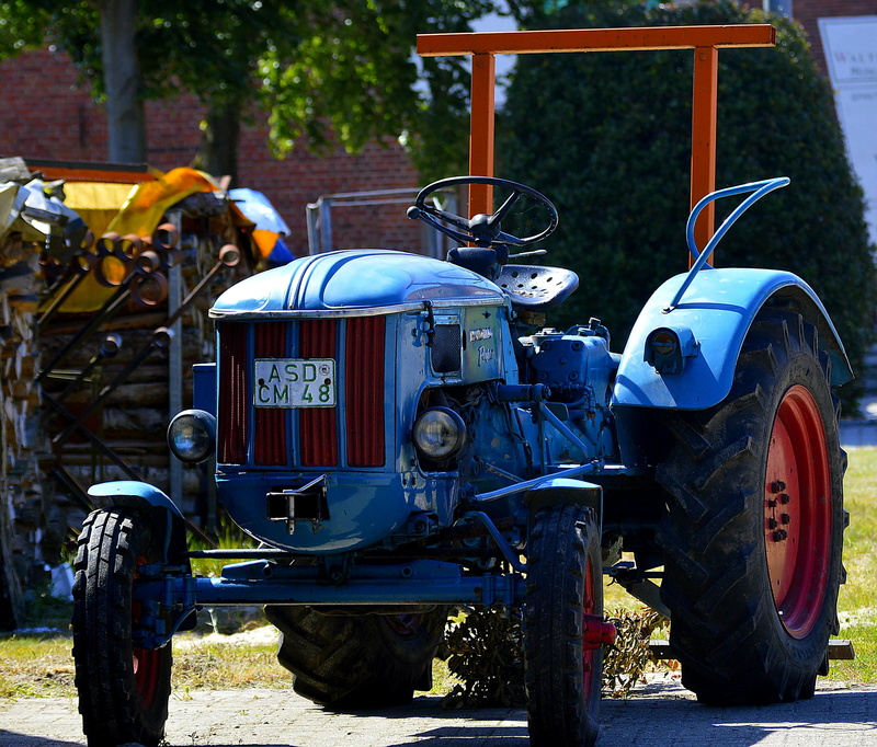 hanomag, blue, old, stationary, red, mode of transportation, no people, mature, oldtimer, agricultural equipment, abandoned, city, sunlight, damaged, road