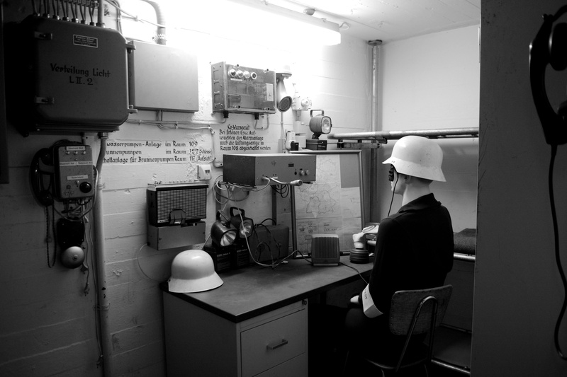 indoors, control, helmet, industrial equipment, real people, civil defense, air-raid shelter, lost places, architecture, control panel, rear view, business