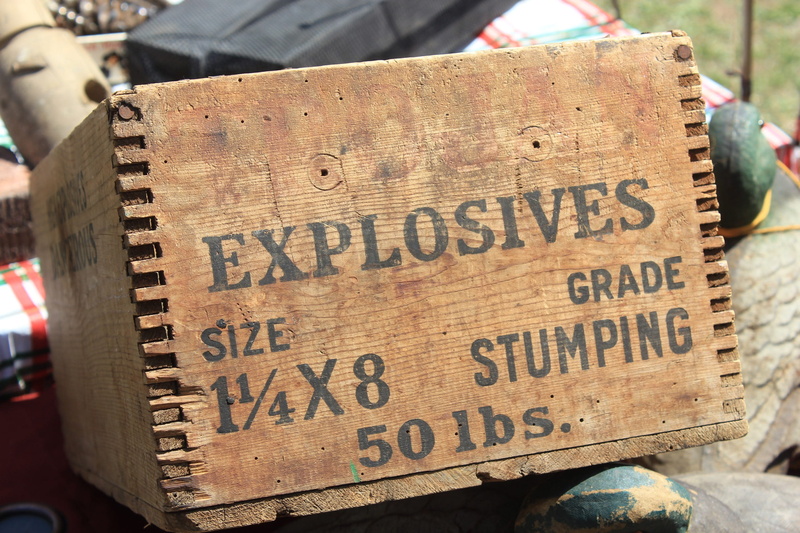 outdoors, 2K, focus on foreground, information sign, incidental people, capital letter, wood - material, information, dynamite, explosives, food, sign