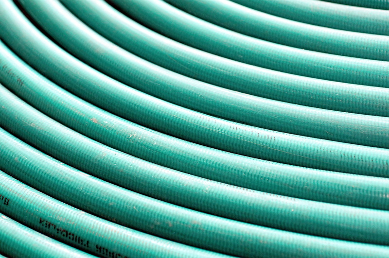 wrapped, full frame, connection, large group of objects, backgrounds, striped, circle, textured, plastic explosive, hose, choice, textile, turquoise colored