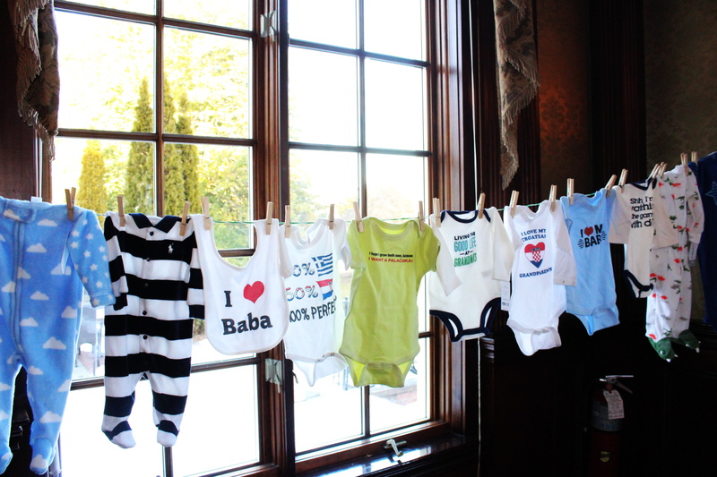window, laundry, glass - material, glass, indoors, baby boy, baby shower, clothing, gift, clothes line, boy, hanging, front, birth, in a row, clothes, for sale