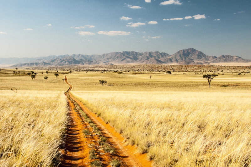 outdoors, tranquility, wolwedans, field, plant, non-urban scene, sky, scenics - nature, beauty in nature, land, mountain, landscape, dirt, grass, sand