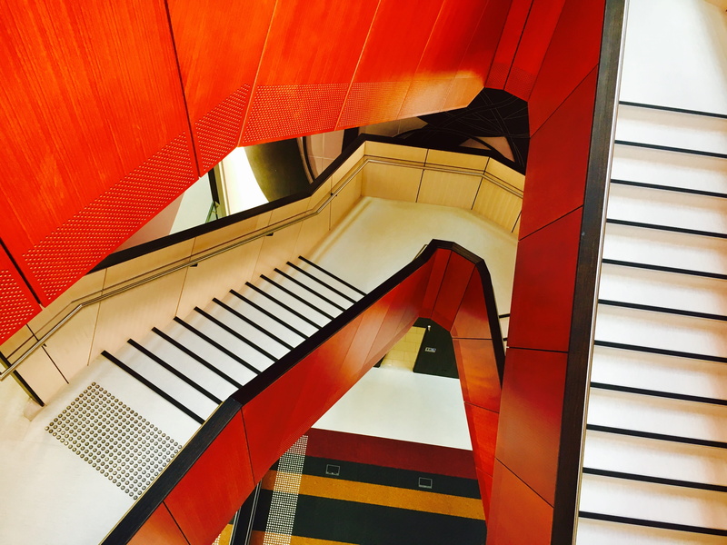 wall - building feature, orange, striped, stairs, musical instrument, no people, steps and staircases, 4K, indoors, architecture, metal, sunlight, low angle view