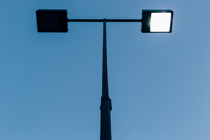 nature, blue color, symmetrical, shadows, connection, balance, street light, no people, copy space, technology, electric light, symmetry, united states