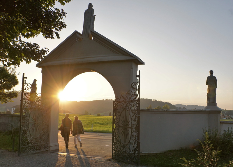 real people, people, silhouette, outdoors, 4K, sunlight, rear view, nature, tree, architecture, sky, couple - relationship, two people, pair, plant, einsiedeln