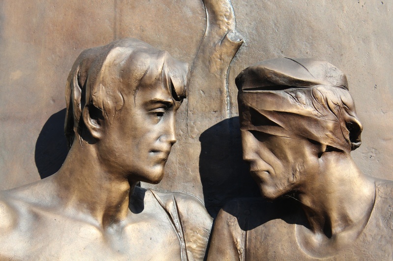 human representation, history, architecture, help, sunlight, outdoors, representation, carving - craft product, solidarity, headshot, statue, two, built structure