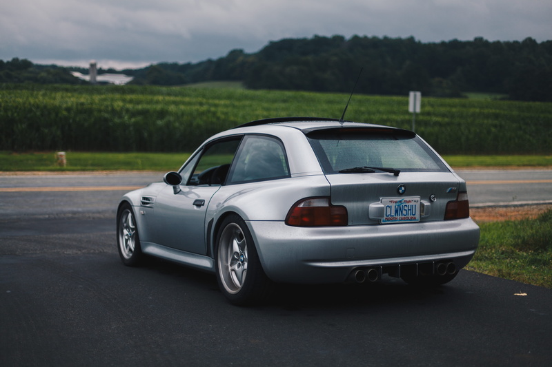 environment, grass, tarmac, road, united states, nature, bmw, travel, sedan, country, transportation, field, outdoors, sports car, landscape, vehicle, day
