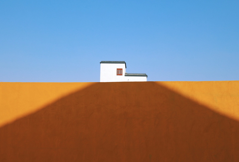 concrete, shadow, brown, desert, soil, architecture, clear sky, blue, house, sunlight, home, wall - building feature, climate, sky, building exterior, nature