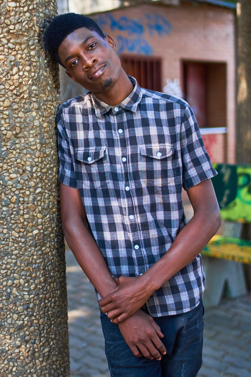 Angolan, casual Clothing, leaning, portrait, lucas cândido fumba, architecture, looking At Camera, 5K, adult, front view, people, person, three quarter length