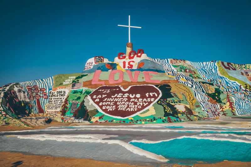 travel destinations, faith, communication, desert, no people, monument, western script, god, multi colored, graffiti, wall, daytime, built structure, street art