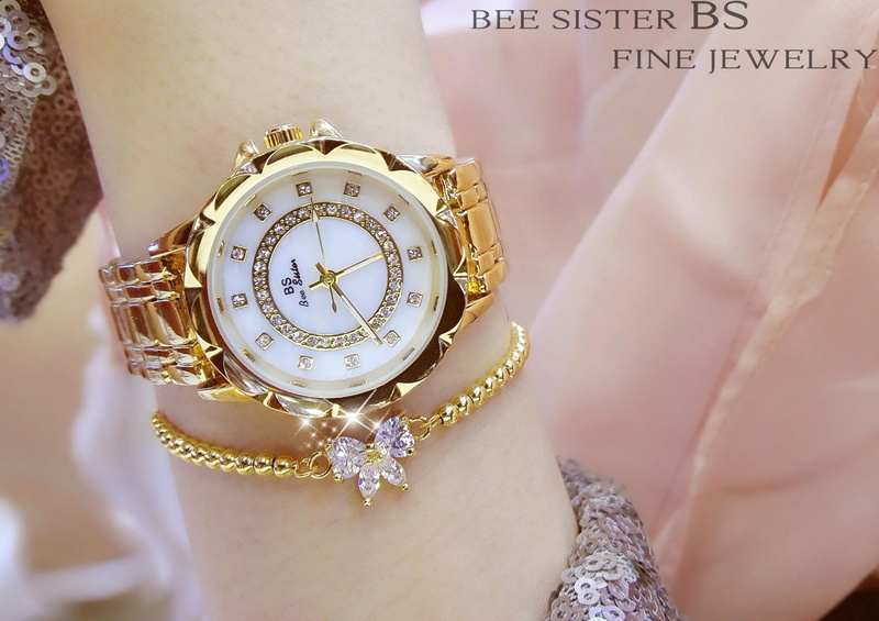 jewelry, personal accessory, midsection, human limb, human body part, wristwatch, luxury, focus on foreground, clock, adult, text, accuracy, wealth, selective focus