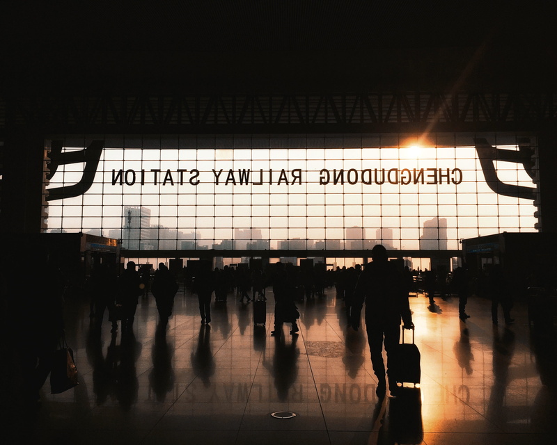 script, western script, inside, airport departure area, chengdudong, people, flooring, reflection, transportation, text, group of people, station, communication