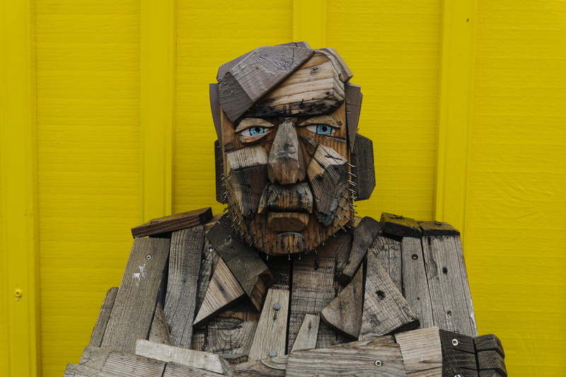 people, man, close-up, carving, male likeness, installation, men, portrait, structure, wall - building feature, sculpture, wood, yellow, male, wooden, human representation