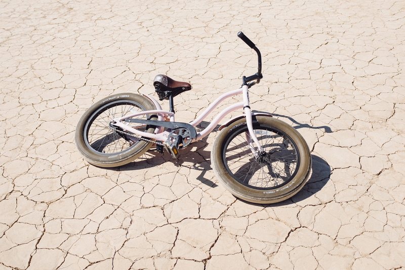 cracked, stationary, wheel, bicycle, transportation, sunlight, day, outdoors, flagstone, architecture, usa, shadow, no people, cobblestone, footpath, soil