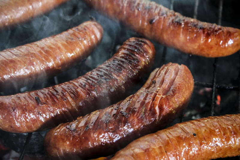 hot dog, eating, high angle view, indoors, focus on foreground, bake, nice time, grill, large group of objects, grate, smoke, sausage, chill, barbecue