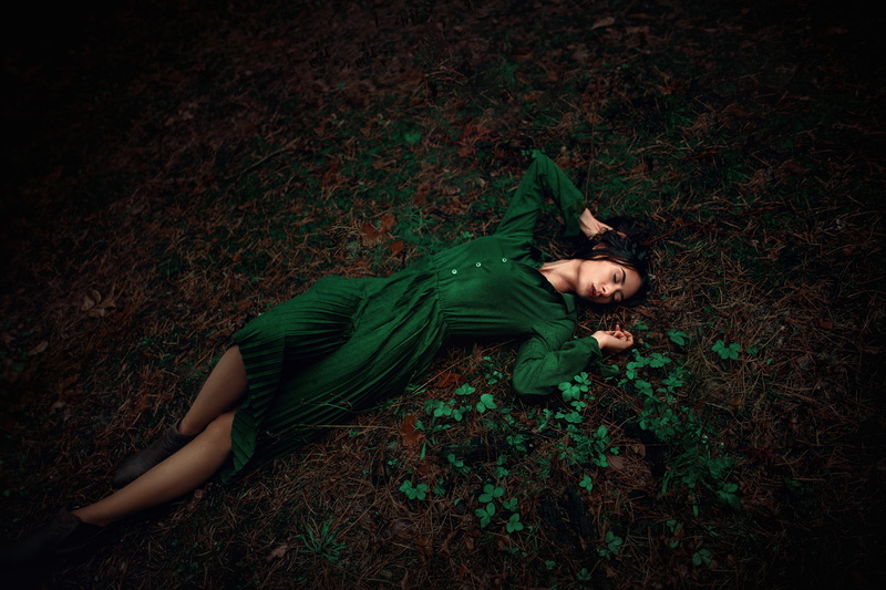 lying down, childhood, leaf, plant part, women, outdoors, young adult, plant, lifestyles, real people, teenager, full length, green dress, leisure activity