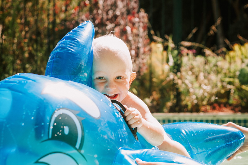 real, kid, baby, 4K, hold on, smile, innocence, males, headshot, looking at camera, inflatable, real people, bokeh, leisure activity, men, outdoors, pool