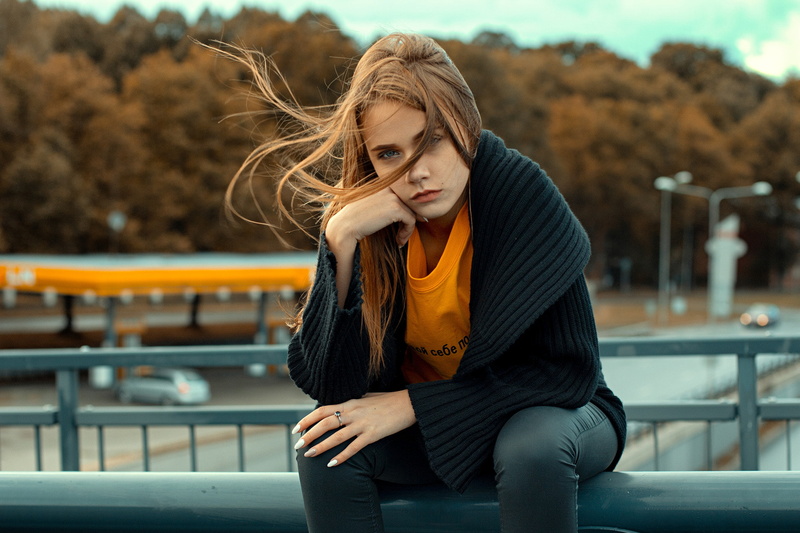 coats, open coat, blue eyes, hair in face, black coat, 1080P, windy, women outdoors, women, looking at viewer, photography, black pants, white nails, face