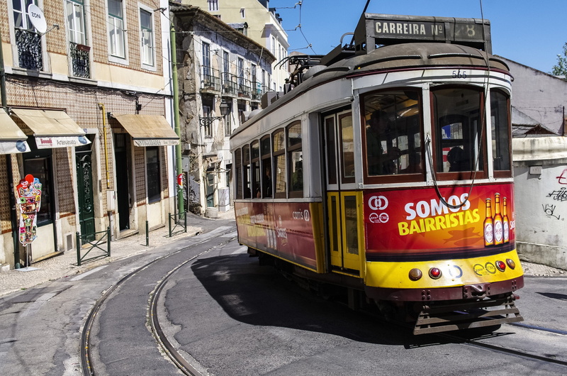 alfama, land vehicle, lisbon, street, 4K, outdoors, track, building exterior, road, text, built structure, cable car, transportation, old, day, architecture