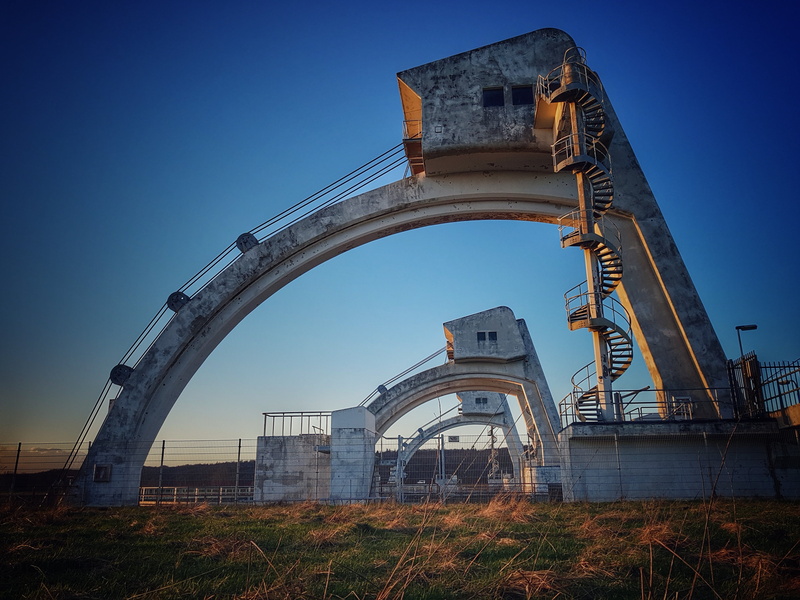 tourism, no people, building exterior, built structure, outdoors, factory, transportation, architecture, low angle view, blue, driel, arts culture and entertainment