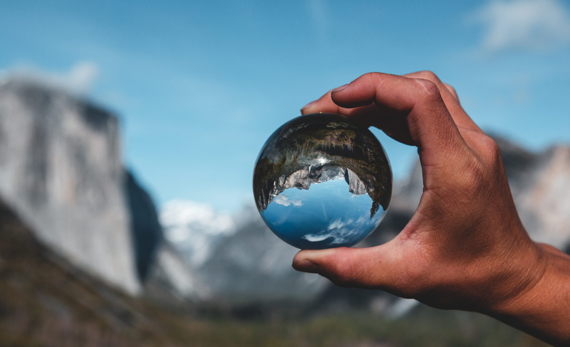 lensball, day, reflections, outdoors, holding, human finger, reflection, environment, finger, human, national park, yosemite valley, person, el capitan