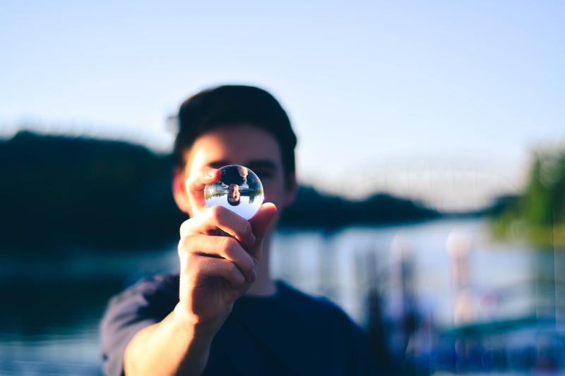 digital camera, man, day, leisure activity, portrait, water, reflection, lensball, holding, photographing, focus on foreground, headshot, photography themes