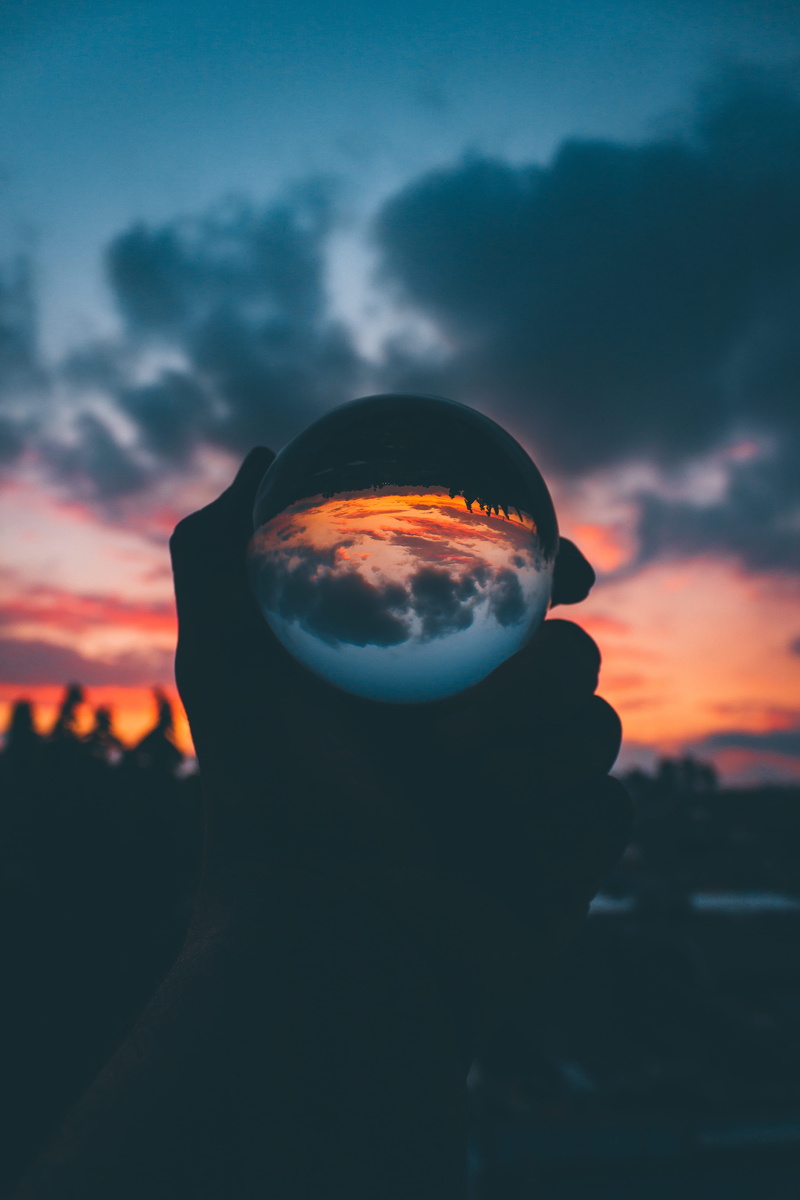 macro, glass ball, person, silhouette, hand, headshot, orange color, leisure activity, cloud - sky, dawn, holding, human body part, lifestyles, sky, portrait
