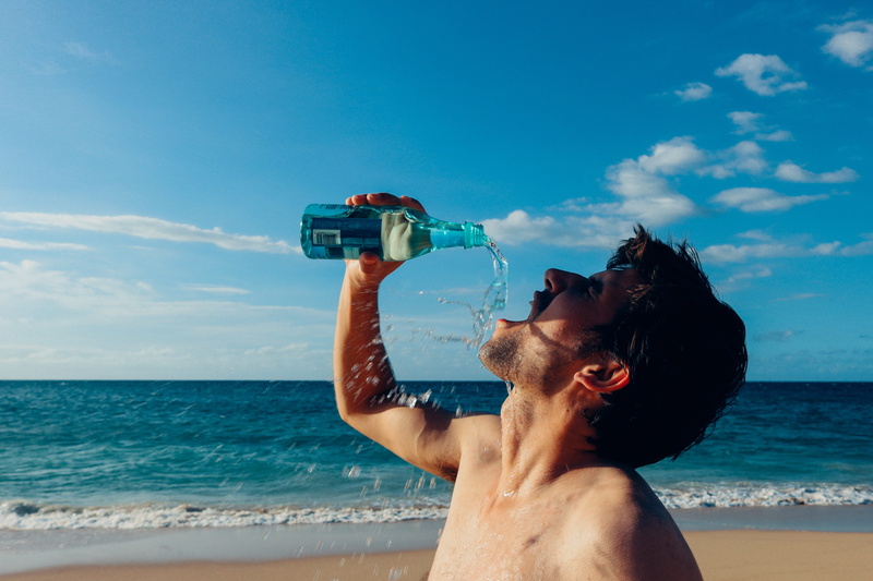 real people, drink water, lifestyles, leisure activity, drinking, man, young adult, time, blue, sky, sea, land, splash, photography, young men, hawaii