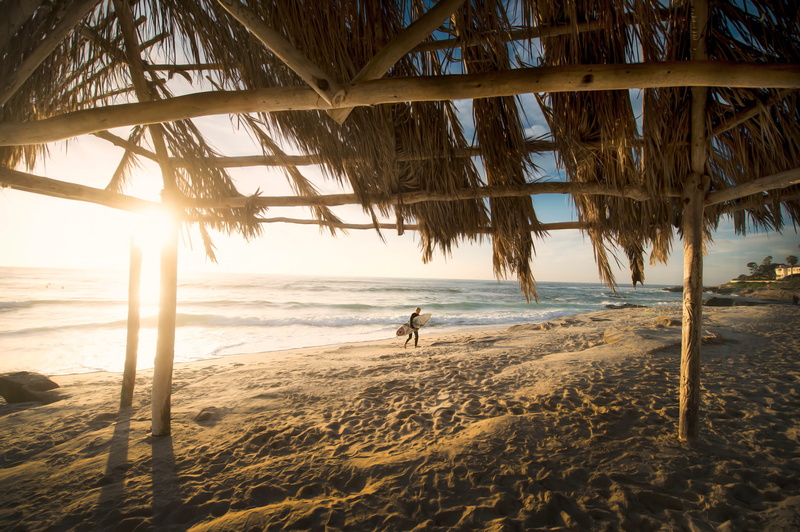 nature, men, walking, sand, leisure activity, roof, sunset, holding, water, people, beauty in nature, person, beach, surfboard, outdoors, surf, board, sea