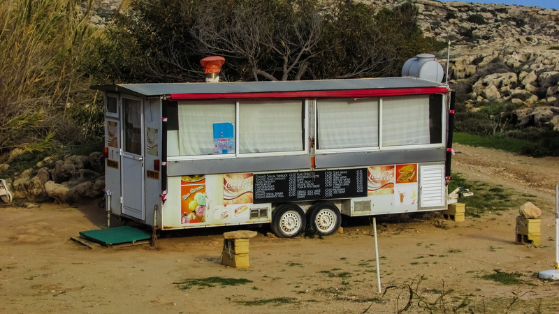 city, stationary, street food, architecture, caravan, building exterior, road, field, truck, cabin, canteen, day, van, plant, cafe, motor vehicle, no people