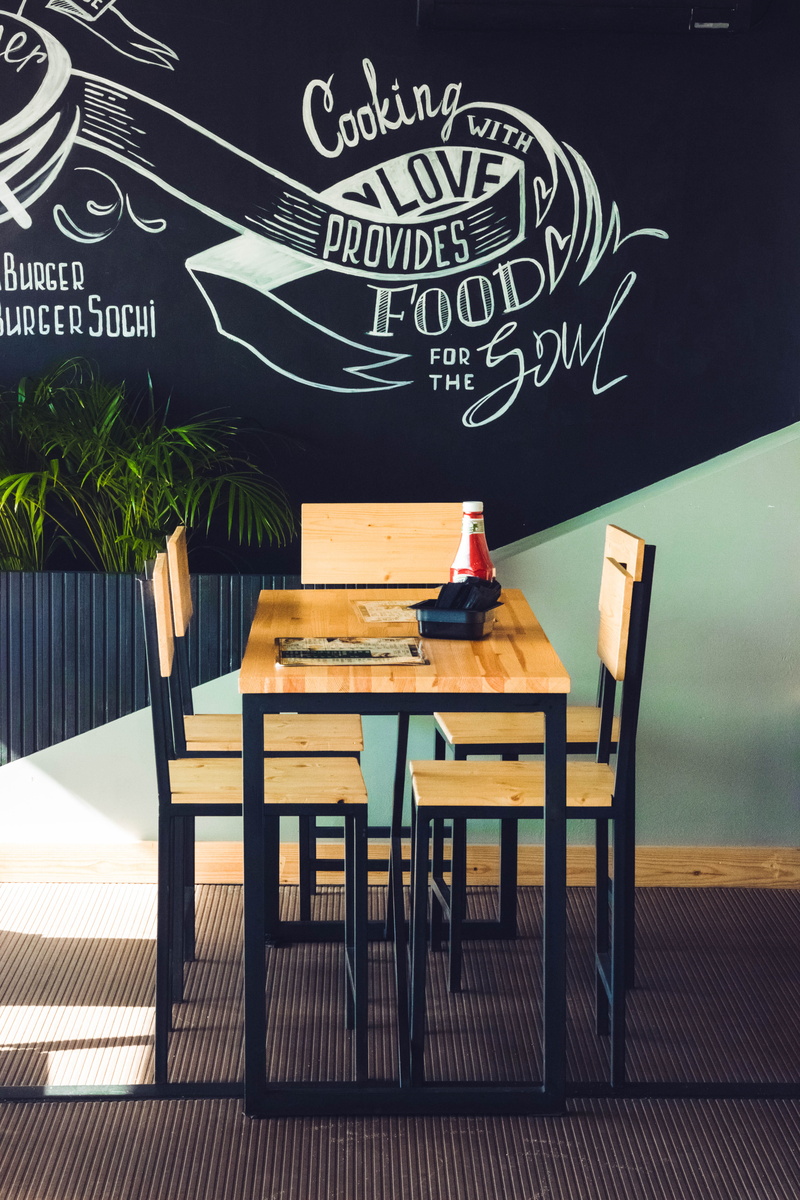 furniture, nature, blackboard, wooden table top, restaurant, wood, indoors, contemporary, board, glass, wooden chairs, education, no people, diner, room