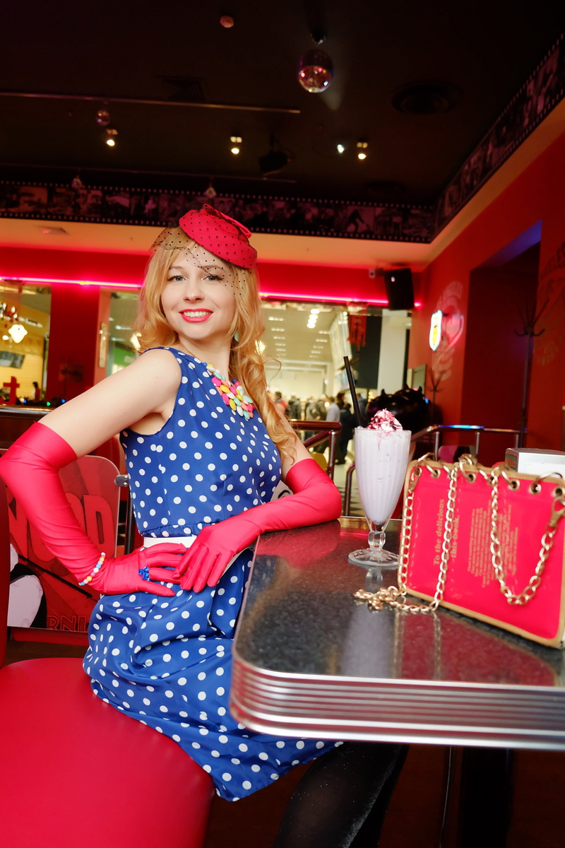 young adult, nutrition, emotion, happiness, canteen, polka dot dress, portrait, consumerism, holding, red, clothing, illuminated, lifestyles, café, leisure activity