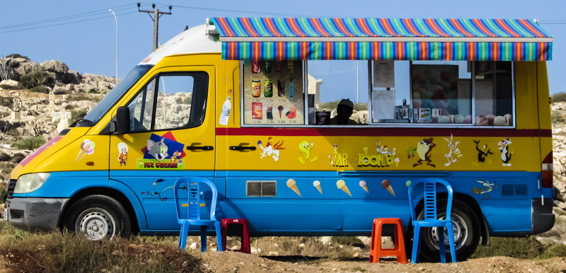 Canteen, blue, sunlight, day, colours, car, summer, yellow, incidental people, motor vehicle, stationary, truck, transportation, sitting, mode of transport