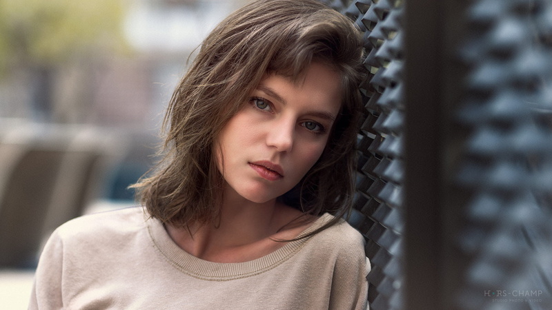 headshot, portrait, day, casual clothing, teenager, childhood, adolescence, one person, blue eyes, front view, close-up, architecture, face, serious, hairstyle