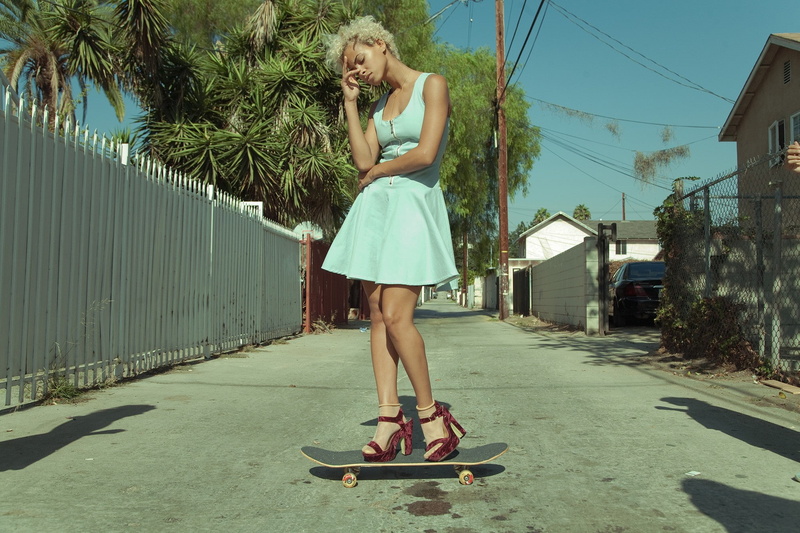 built structure, skateboard, 1080P, women outdoors, women, balance, full length, lifestyles, young adult, curly hair, summer  dress, casual clothing, hairstyle