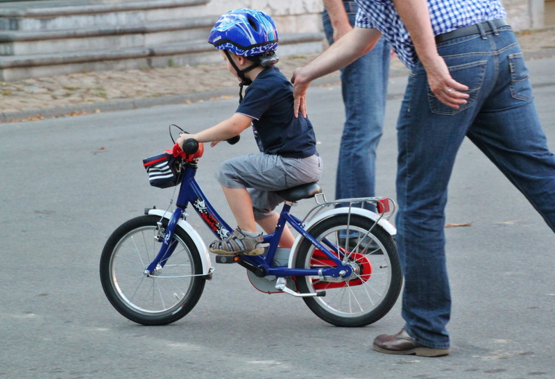 positive emotion, riding, sports helmet, help, bike, keep, transportation, on push, headwear, cycling, two people, casual clothing, ride, jeans, togetherness