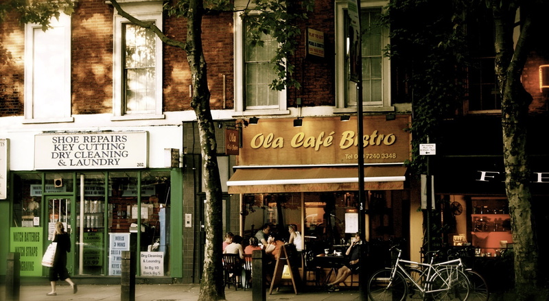 sign, group of people, bistro, ola, building exterior, information, ola cafe bistro, day, communication, information sign, people, built structure, signage